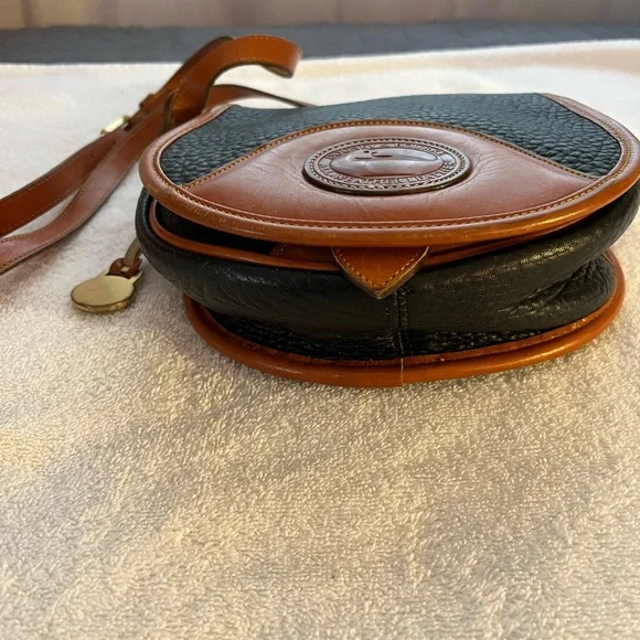 Dooney & Bourke All Weather Leather Black & Tan Saddle Crossbody Bag. - Picture 3 of 9